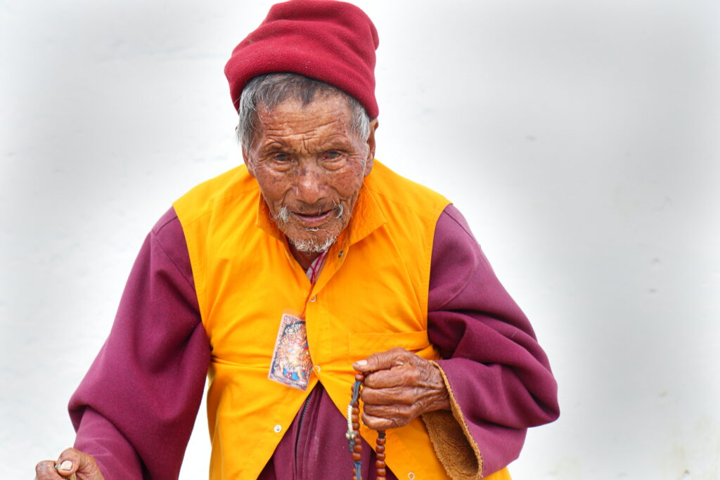 12th image from my "Portrait from Bhutan" series. An elderly Buddhist monk was circling around the temple and chanting inside Kyichu Lhakhang in Paro, Bhutan.