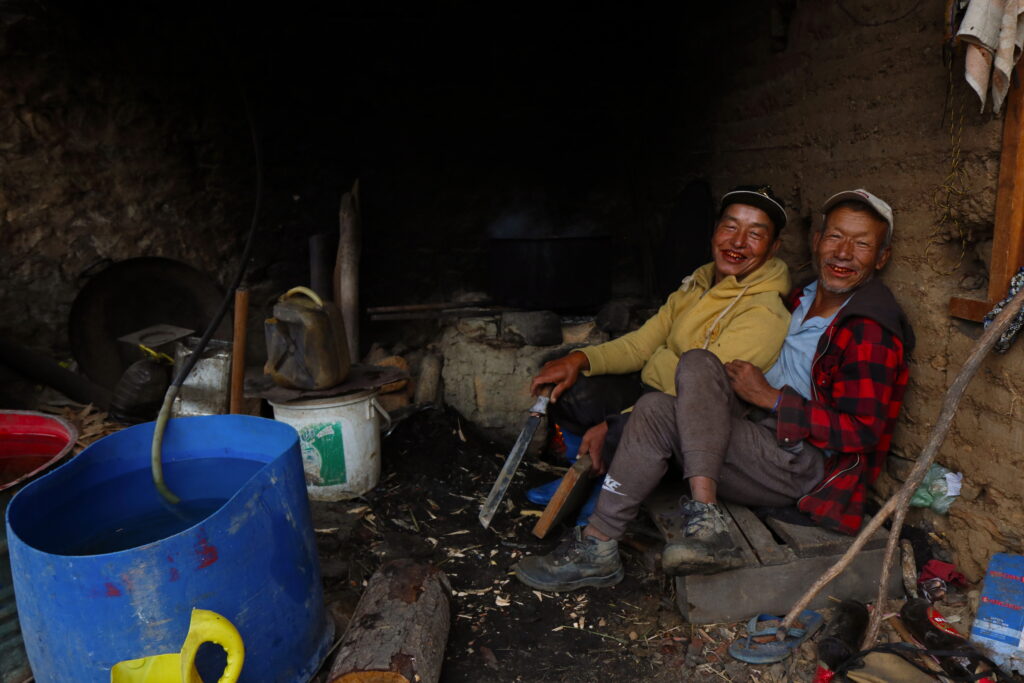 3rd image from my "Portrait from Bhutan" series. This is was taken in Paro. These two friends were working in a roadside workshop. While I was passing across the road, I saw them and instantly pointed my camera at them. They were very happy posing for this picture. 