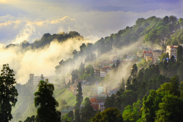 A part of Darjeeling town with wrapped on rolling clouds which is a common scene in monsoon.