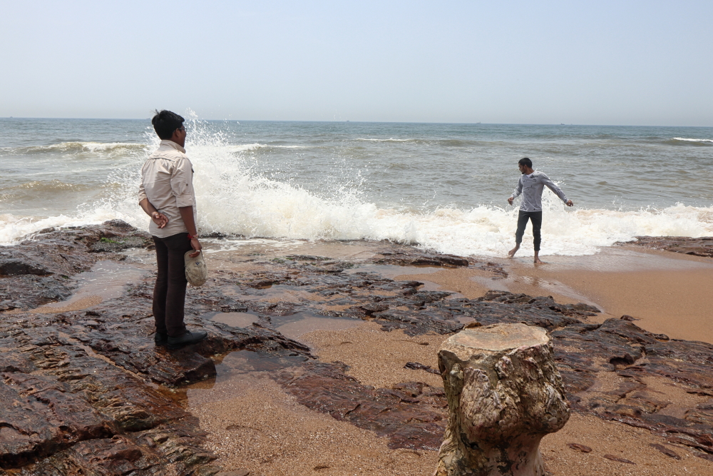 An image of locals enjoying waves in Bheemili beach in Vizag.