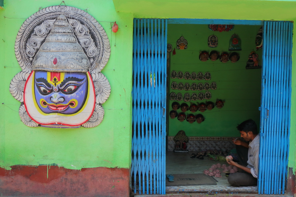 Image of a small roadside workshop in Charidah Village. Charidah is the village of Chau mask makers in Bengal.