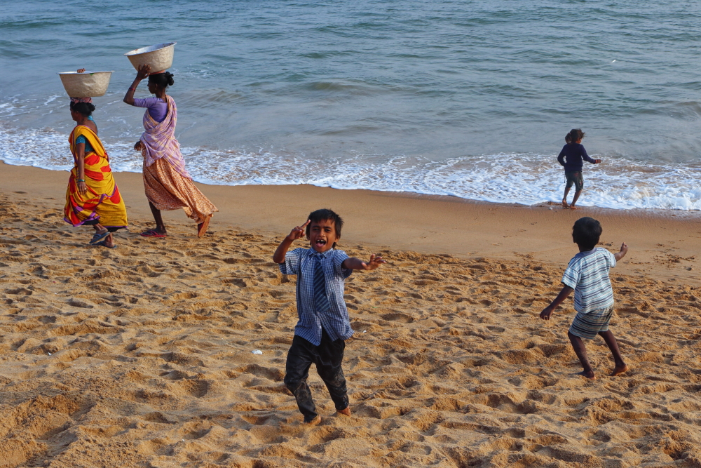 Kids having fun at the sea beach