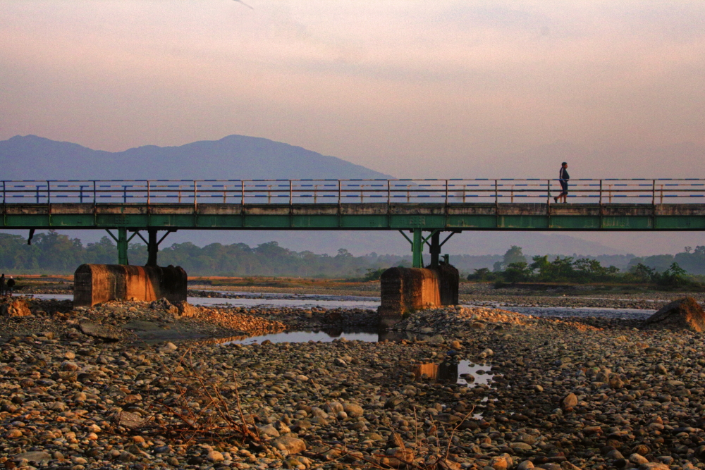 A lone morning walk in the empty river bridge is the best experience in Murti. 