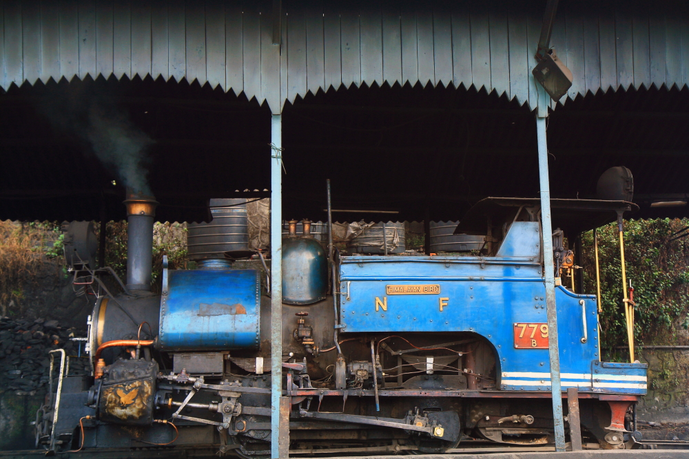 A steam locomotive inside Darjeeling Rail Workshop