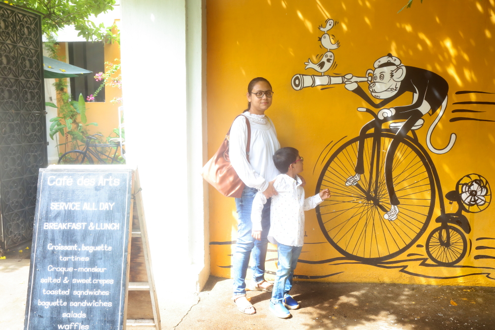 An interesting mural in front of Cafe Des Arts in Pondicherry. My son was more curious with the mural than posing for the photo.