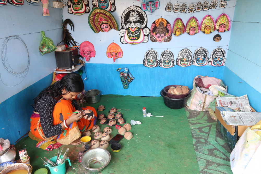 Women in Charida village also take part in Chau mask making.