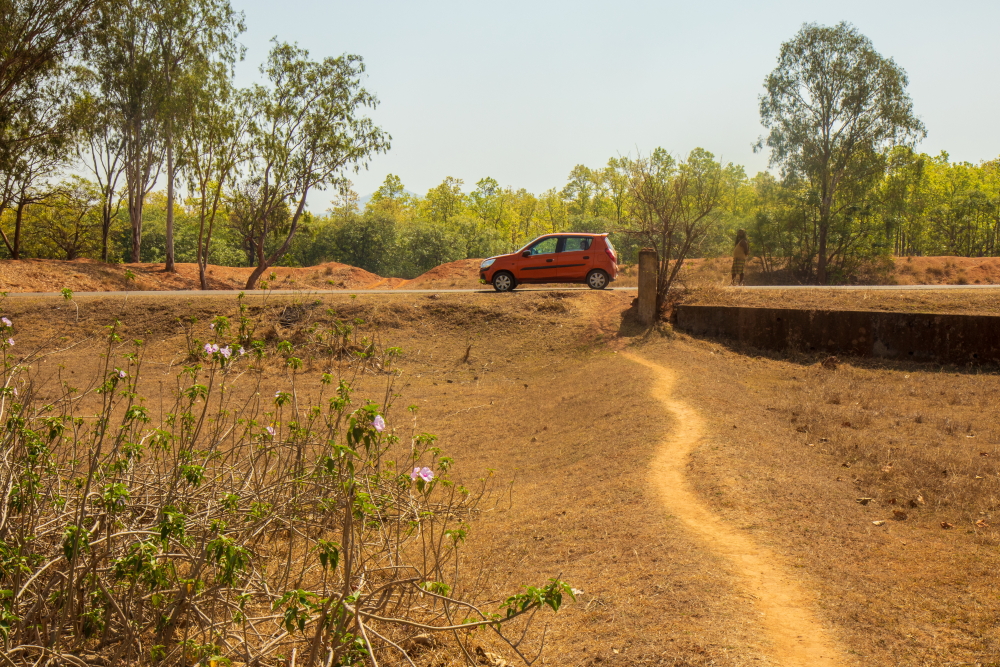 Our car parked beside the road to Rairangpur from Bisoi in Mayurbhanj district, Odisha